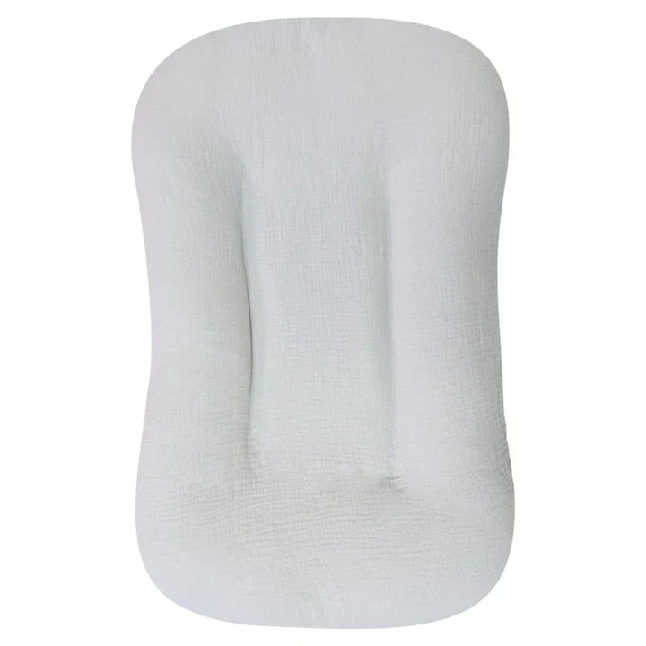 Close-up of the soft, breathable fabric & secure side walls of the baby lounger infant nest.