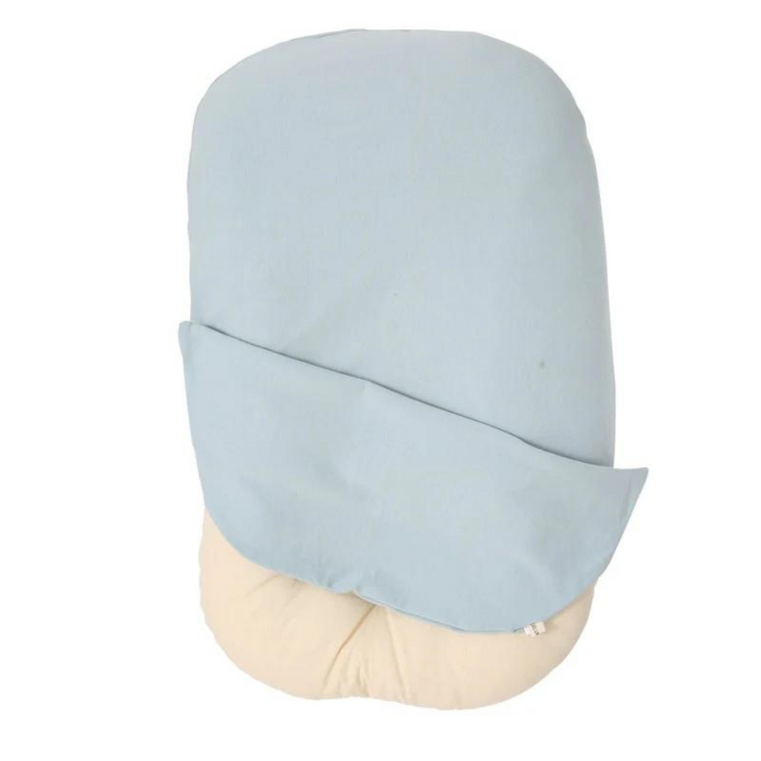 Newborn sleep lounger in a modern nursery setting. Neutral decor fits any baby's room design.