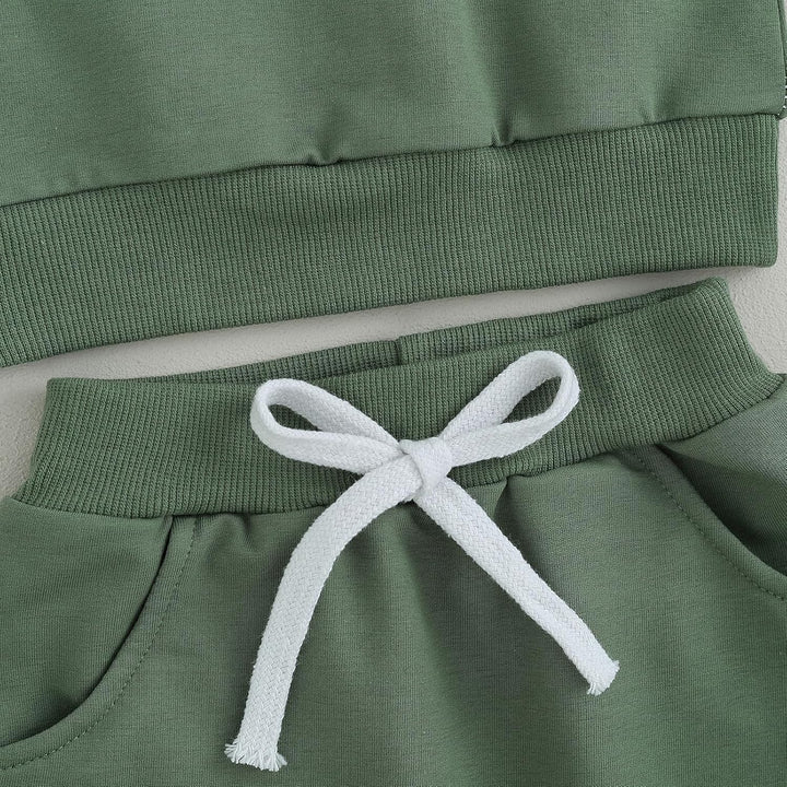 Adorable baby winter jogger set, contrast sweatshirt with matching trousers, cozy.