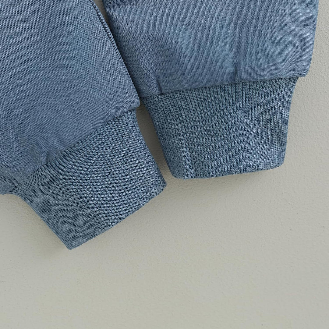Outdoor shot of baby jogger set, contrast design, keeping baby warm in winter.