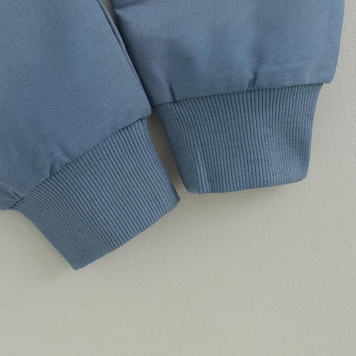 Outdoor shot of baby jogger set, contrast design, keeping baby warm in winter.