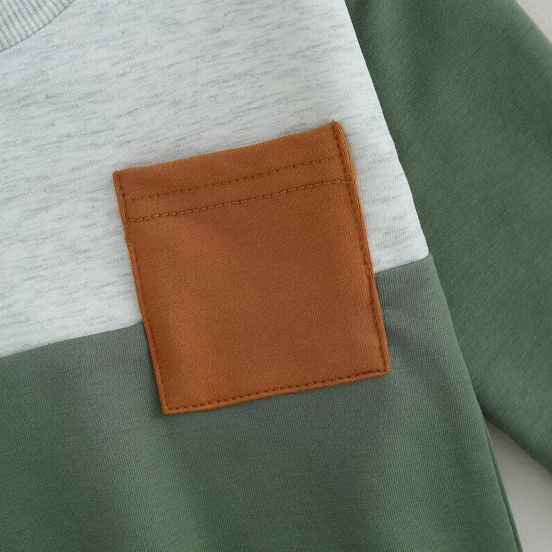 Stylish baby wearing contrast jogger set, cozy and fashionable winter look.