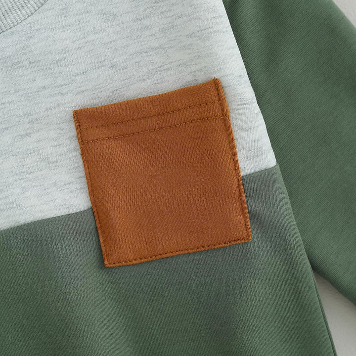 Stylish baby wearing contrast jogger set, cozy and fashionable winter look.