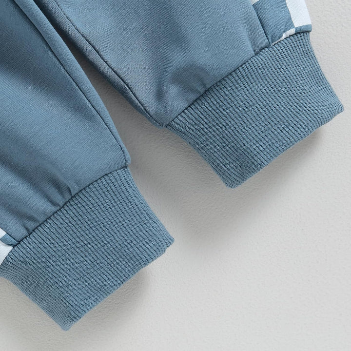 Baby jogger set, contrast fabric texture of sweatshirt and trousers, tactile feel.