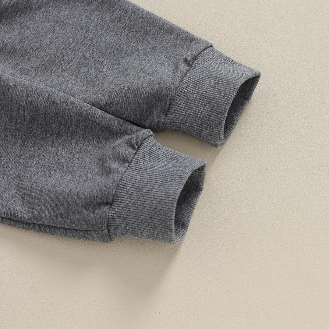 Top-down view of baby jogger set, contrast coloration, complete winter outfit.