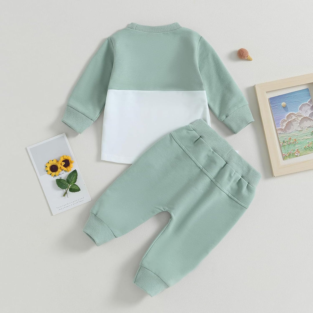 Photograph of baby jogger set, contrast design, suitable for all genders.
