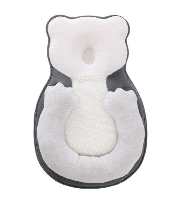 SnuggleSleep baby bed with orthopedic pillow for flat head prevention, offering optimal newborn support.