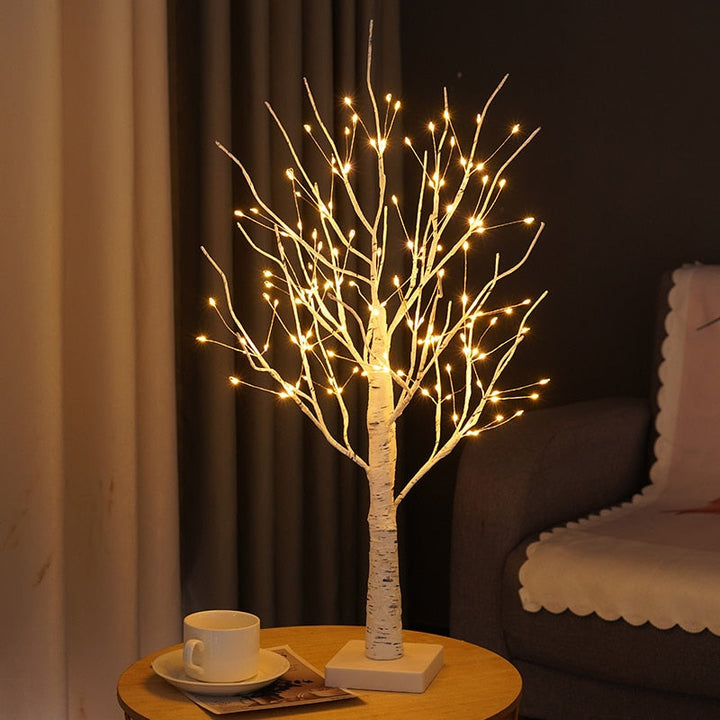 Decorative birch tree lamp glowing with warm LED light, enhancing any Scandinavian-themed room