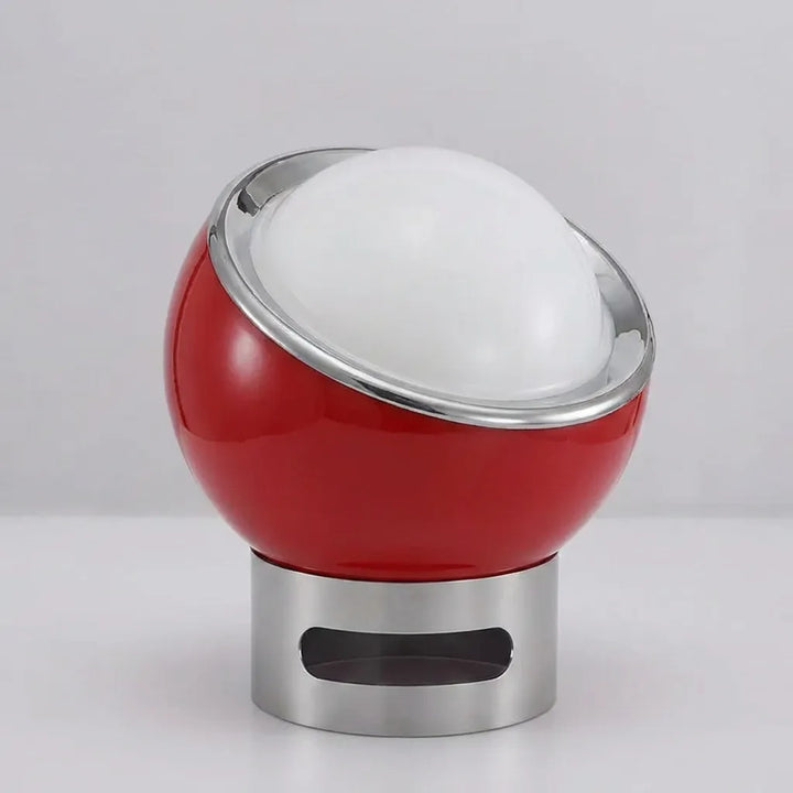Bauvola Bauhaus desk lamp on a bookshelf, providing soft ambient light and enhancing modern interior design