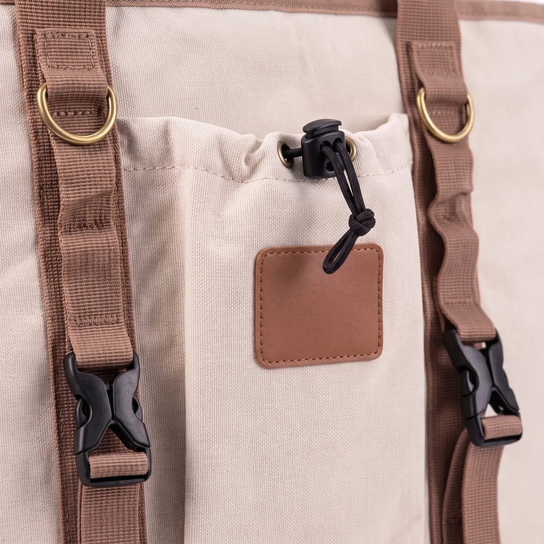 Portable beige insulated cooler bag, perfect for outdoor adventures, travel, and keeping drinks cold.