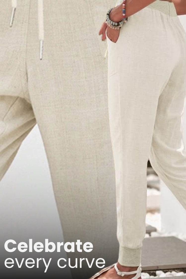 Stylish women's pants for everyday wear, featuring a comfortable elastic drawstring waist and tapered design.