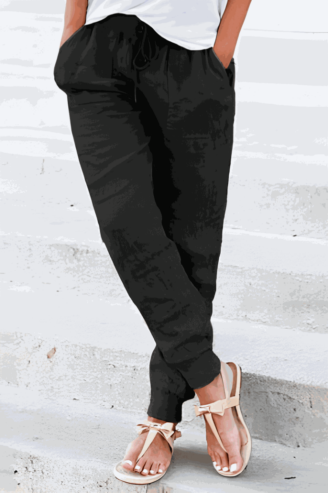 Black women's loungewear joggers, featuring an elastic drawstring waist for ultimate comfort & a sporty look.