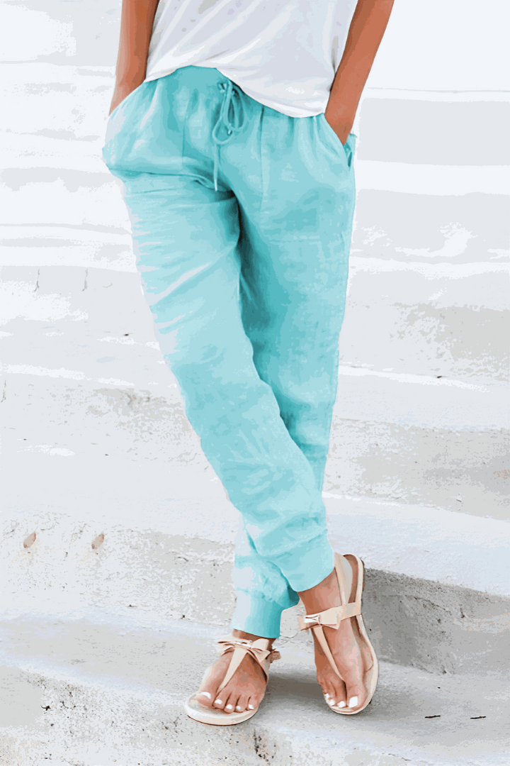 Khaki women's casual pants with a comfortable fit, tapered leg, and adjustable drawstring for daily wear.