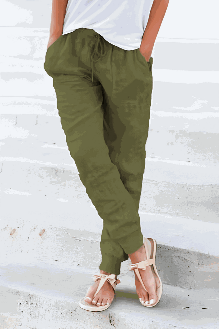 Comfortable women's pants with a drawstring waist, designed for loungewear and casual daily activities.