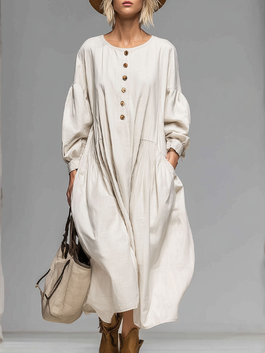 Beige women's loose fit midi dress with long sleeves, button-front, and practical pockets for casual comfort.