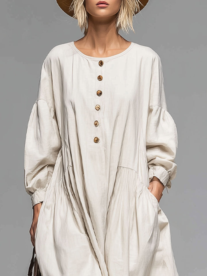 Chic women's long sleeve midi dress; loose, button-front design with pockets, perfect for versatile everyday wear.