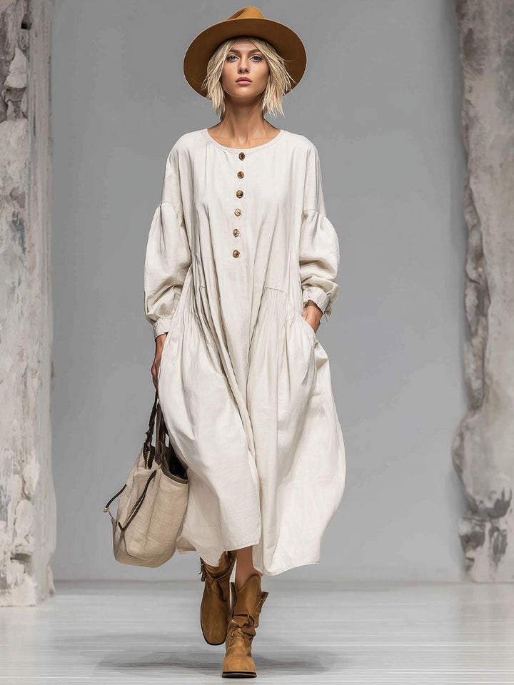 Timeless beige long sleeve midi dress with a loose fit, elegant button-front, and functional pockets for women.