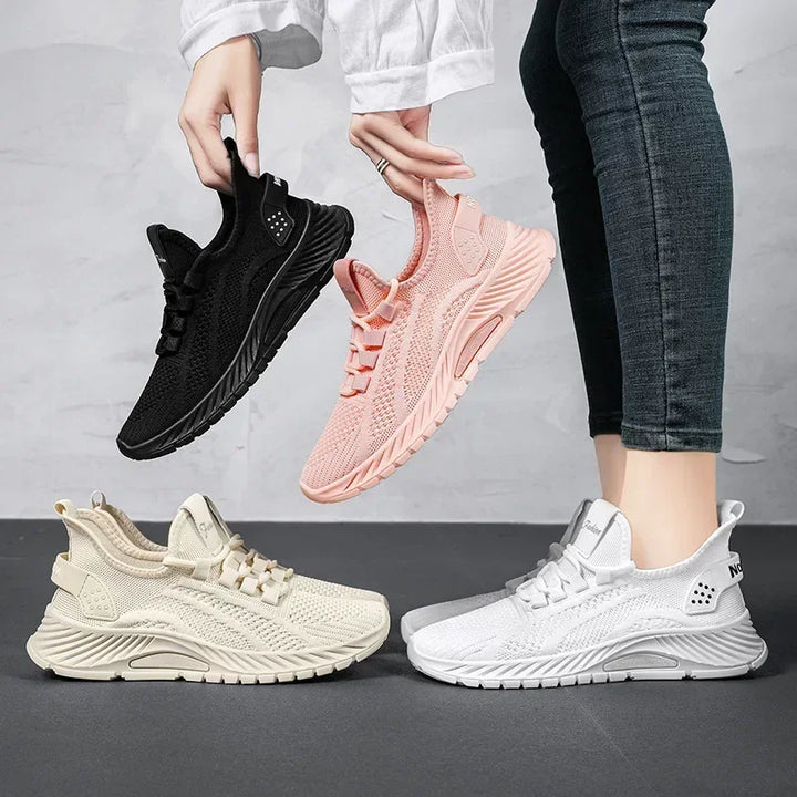 Stylish pink women's walking sneakers, designed with orthopedic features & cushioned comfort.
