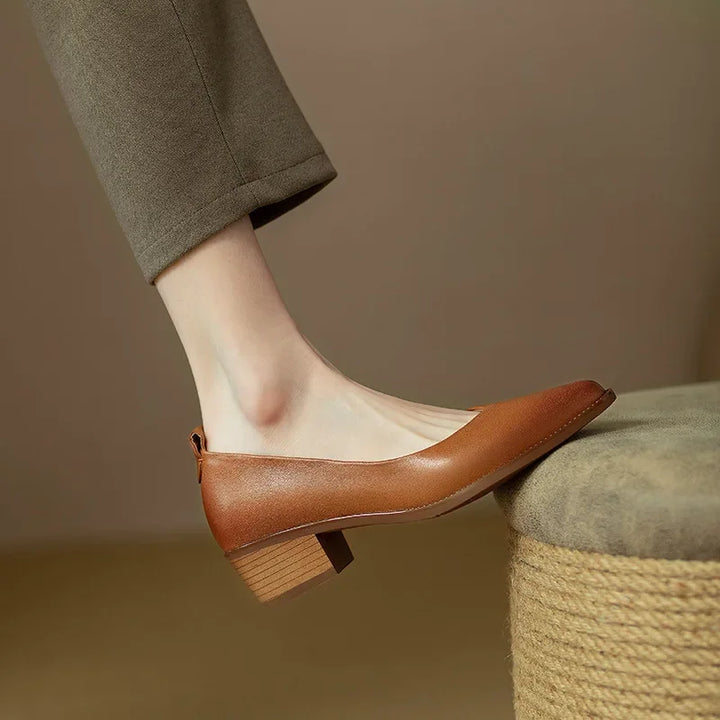 Elegant brown women's pointed toe slip-on block heel court shoes for professional wear.