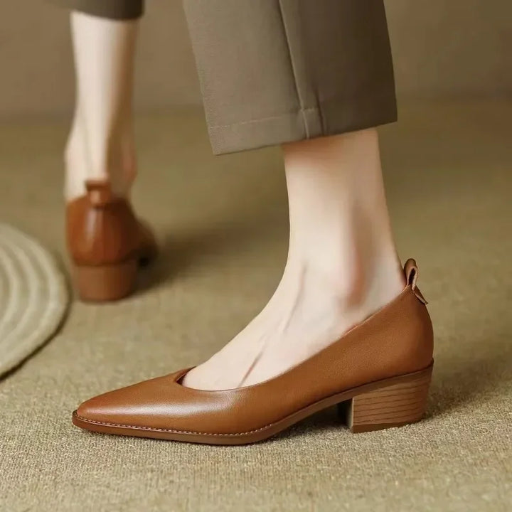 Comfortable beige pointed toe slip-on block heel court shoes for women, all-day wear.