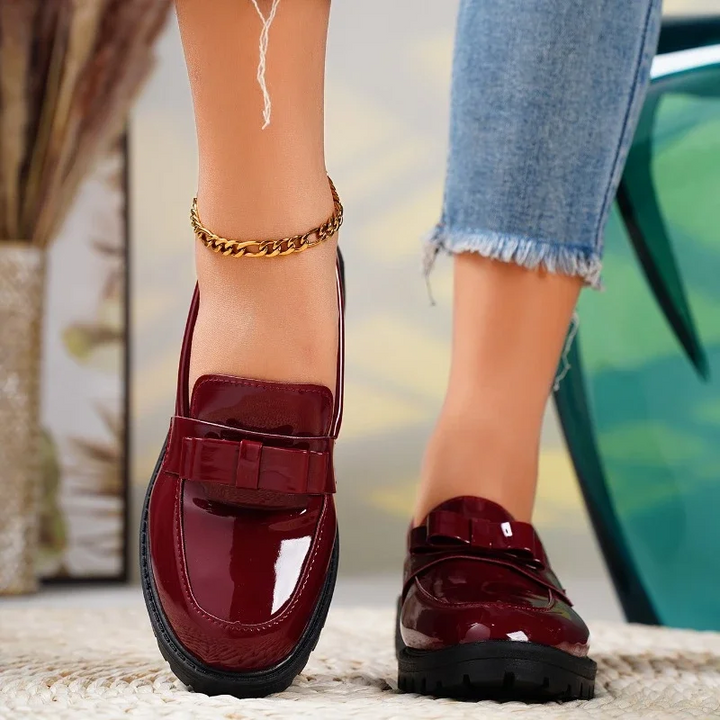 Women's burgundy bow loafers. Comfortable slip-on shoes with a stylish design & chunky sole. Elegant footwear.