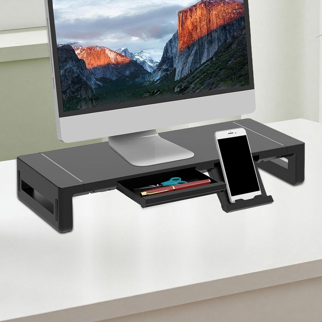 Stravon height adjustable monitor stand in black with a convenient pull-out drawer