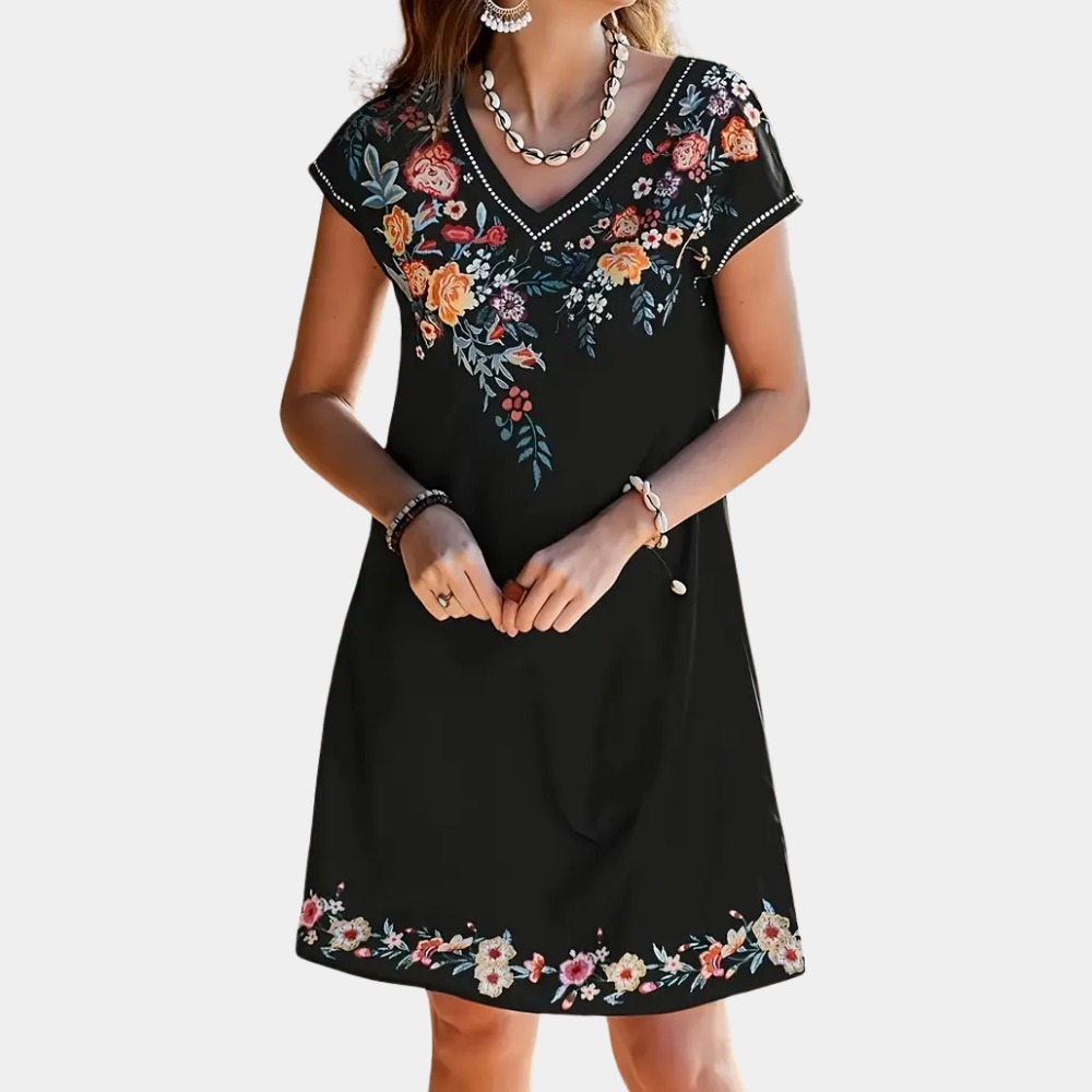 Black floral summer dress for women. Flowy, short, and trendy, perfect for casual wear, parties, or vacation.
