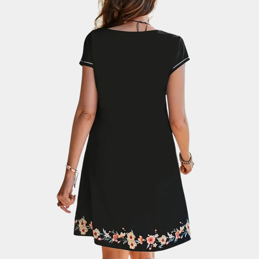 Trendy black floral summer dress for women. Flowy, short, ideal for casual outings & party wear.