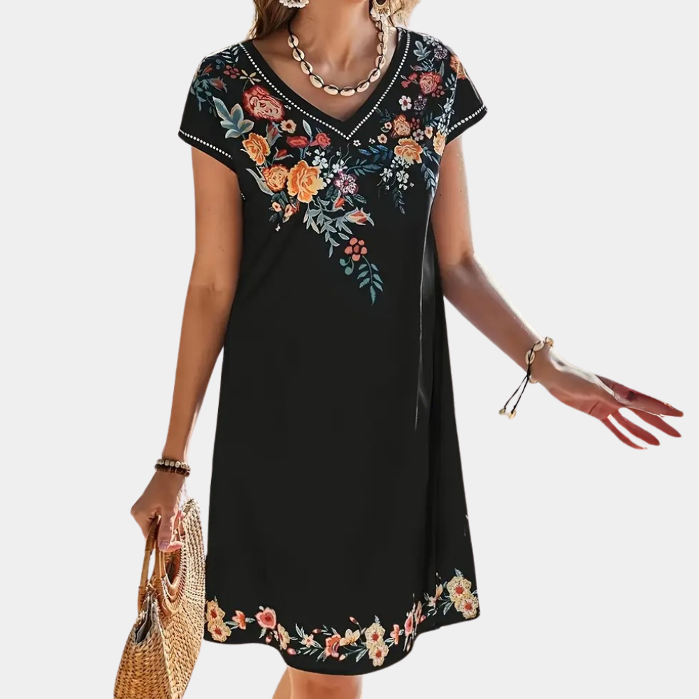 Women's flowy black floral dress, short style, perfect for summer, vacation, or casual parties.