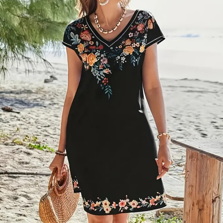 Casual black floral summer dress for women. Short, trendy, and flowy, great for vacation & party.