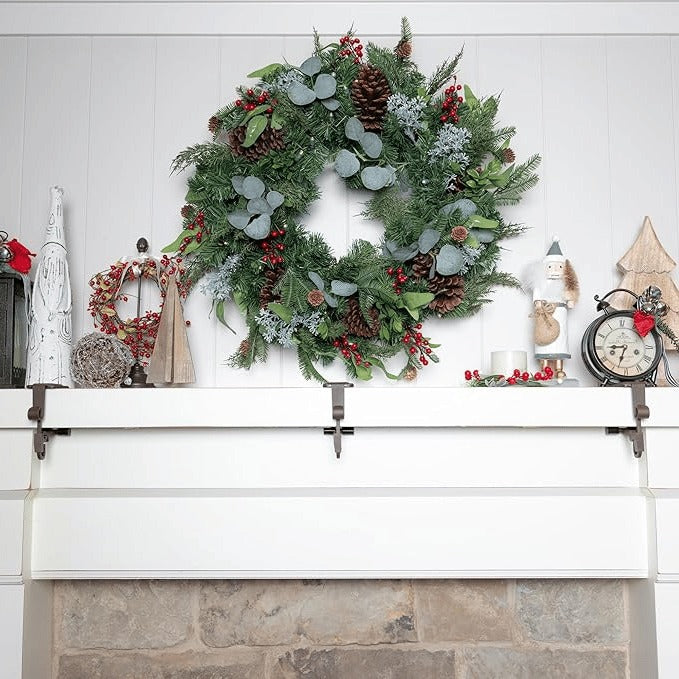 Adjustable black & gold mantle holders for Christmas stockings & festive garlands.