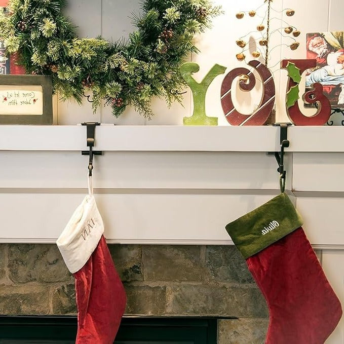 Black & gold Christmas stocking holder & matching garland holder for festive mantle.
