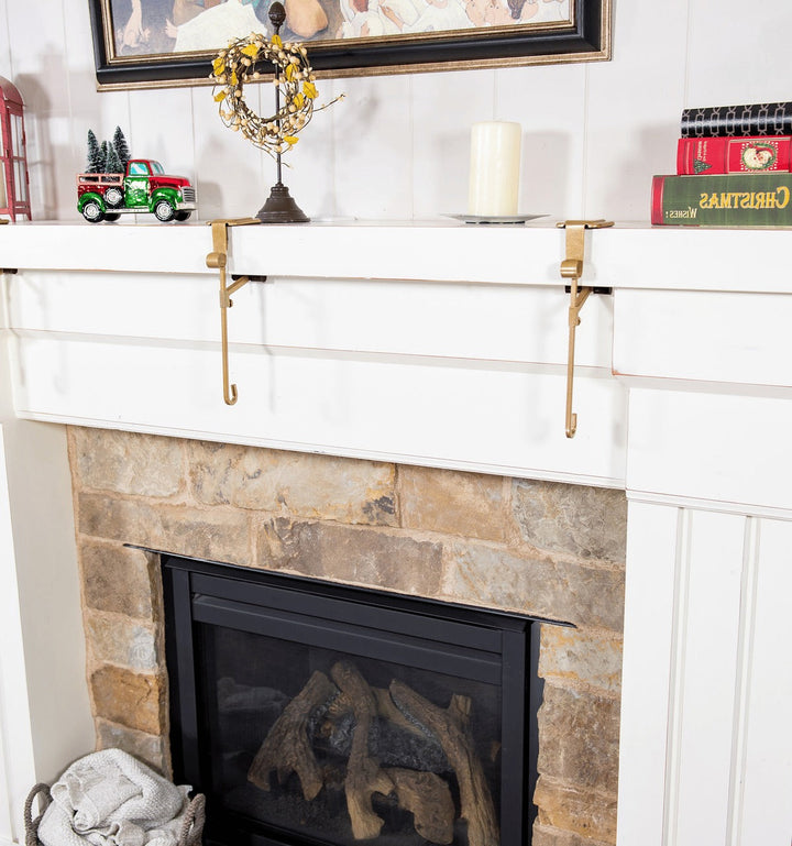 Premium black & gold festive mantle holders for Christmas stockings & garlands.