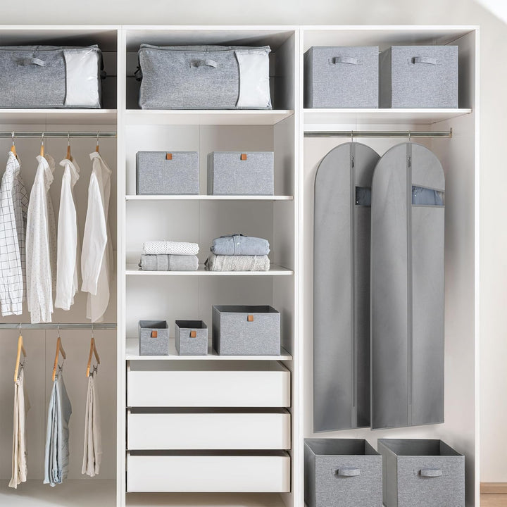 Garment bag being packed with multiple garments, ideal for extended trips