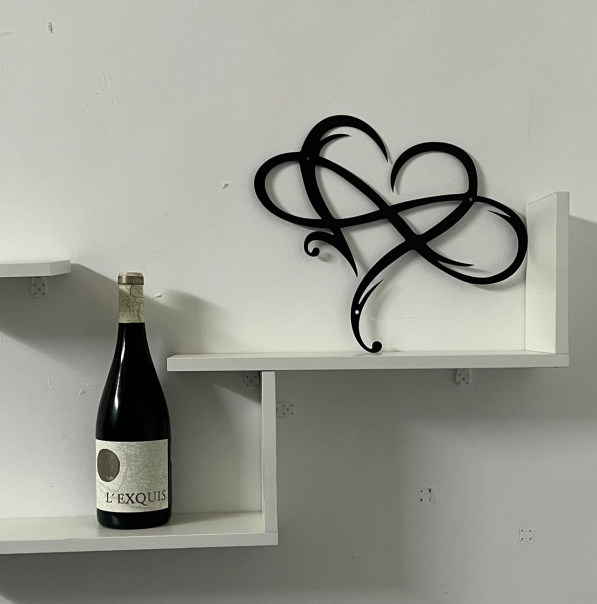 Artistic Infinity Heart steel sculpture, a contemporary love symbol and captivating metal wall art.
