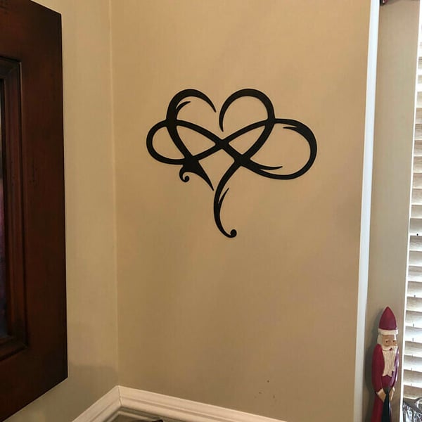 Polished black steel Infinity Heart art, a durable & stylish wall decoration for love-themed spaces.