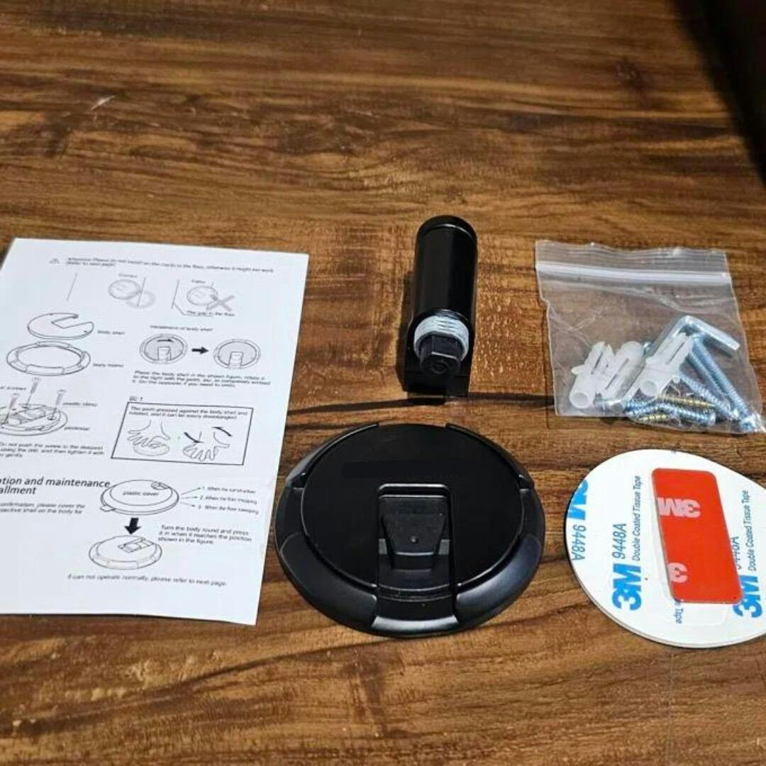 Silent magnetic door stopper in black, drill-free for wall protection & securely holding doors with ease.