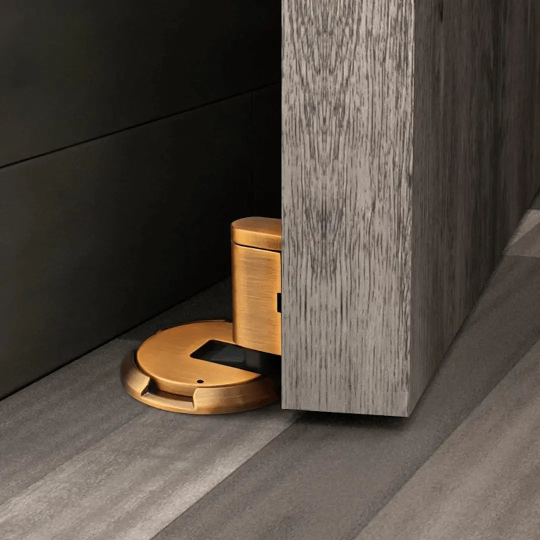 Sleek bronze magnetic door holder; no-drill, self-adhesive for quiet home, floor & wall protection.