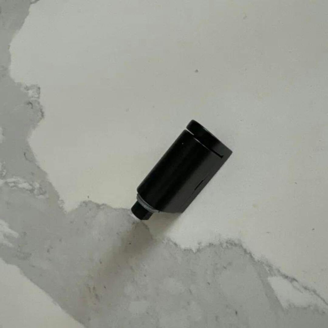 Black & bronze magnetic door stoppers: no-drill, self-adhesive for modern home safety & floor protection.