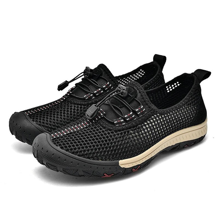 Black men's breathable slip-on loafers for summer. Lightweight & comfortable casual footwear, ideal for daily wear or travel.