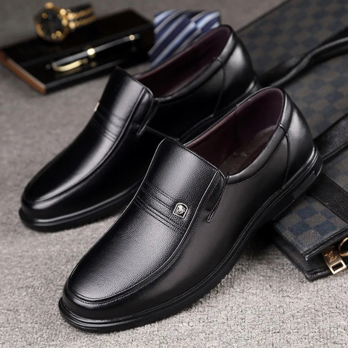 Side profile of sleek black men's slip-on dress shoe, ideal for professional office, formal fashion & special occasions.