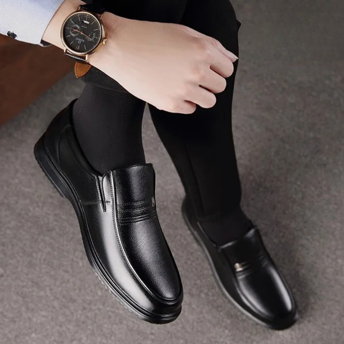 Classic brown men's slip-on dress shoes, front view, offering comfort for formal, professional & elegant office wear.