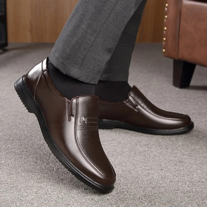 Detailed stitching on a men's classic slip-on dress shoe, emphasizing quality for formal, professional & elegant wear.