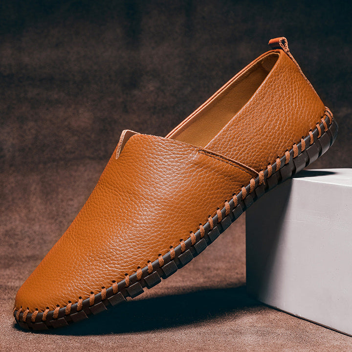Black men's sleek slip-on loafers, versatile for formal & casual wear. Classic comfort footwear.
