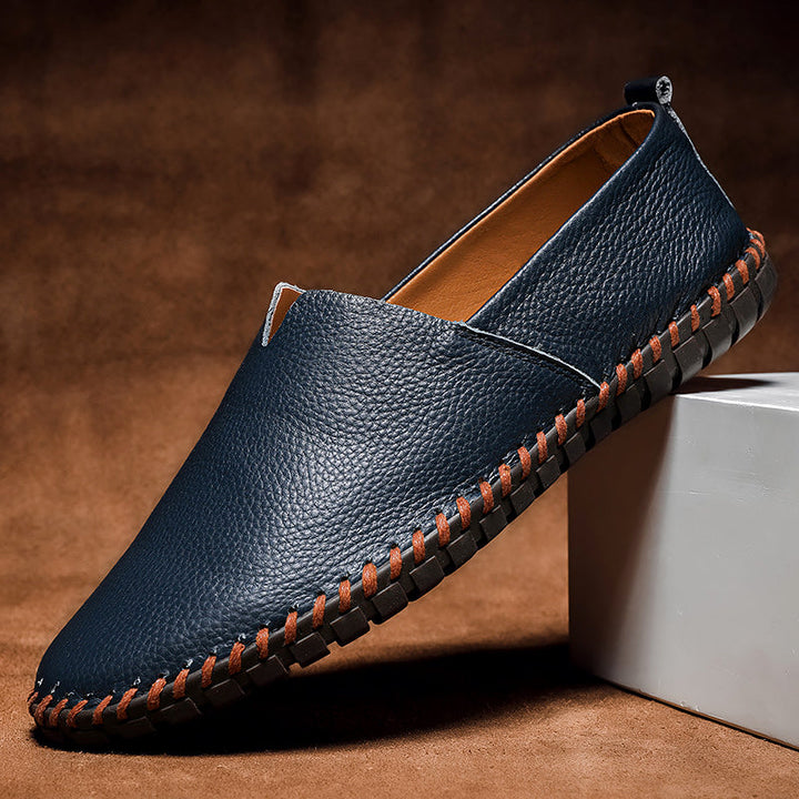 Brown men's classic slip-on loafers, versatile style for formal and casual outfits. Comfortable footwear.