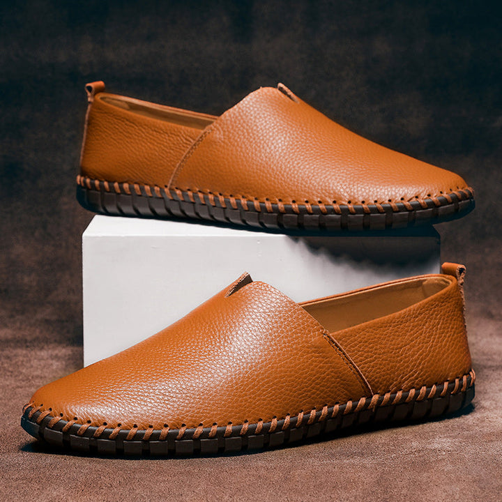 Casual white men's slip-on loafers, for a relaxed yet stylish everyday look. Comfortable versatile footwear.