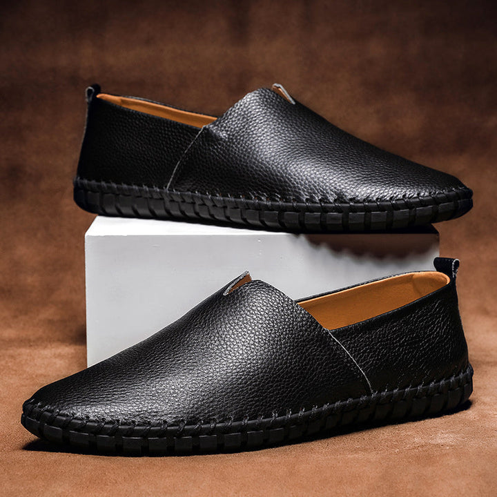 Close-up of sleek men's slip-on loafer texture, highlighting premium material & classic design. Versatile.