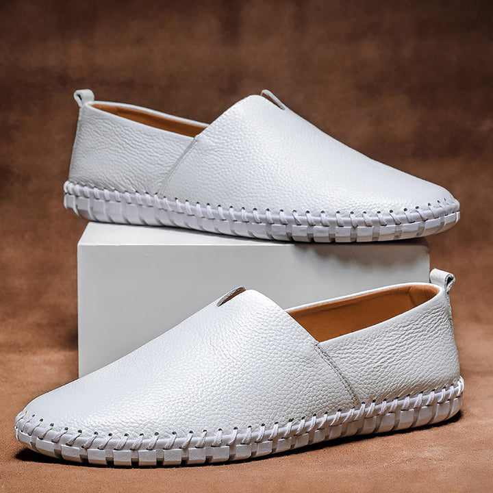 Side profile of men's versatile slip-on loafers, showcasing sleek silhouette & comfortable design. Footwear.