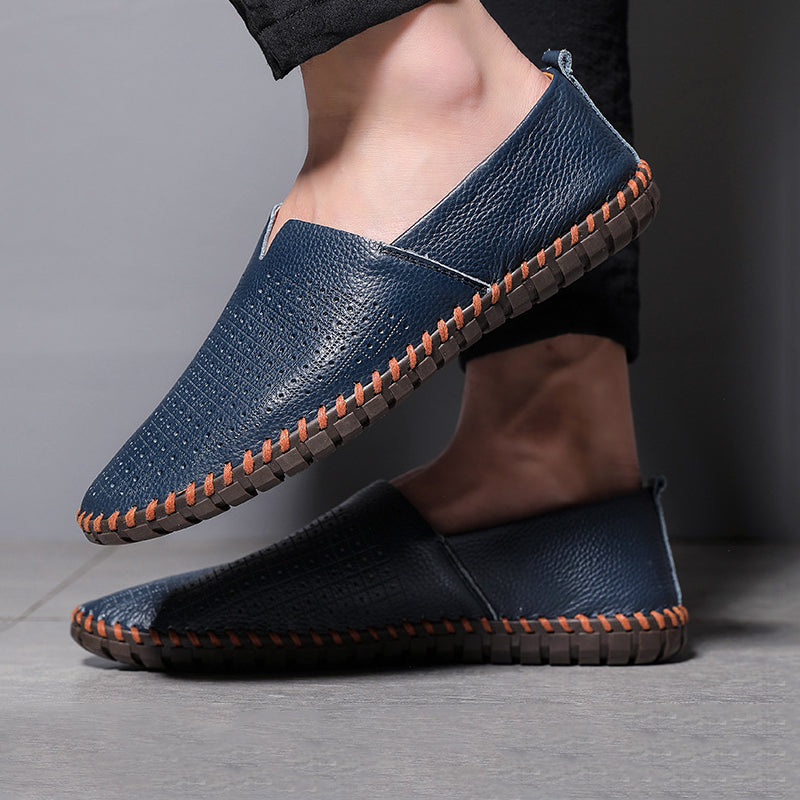 Pair of men's versatile slip-on loafers in black, emphasizing sleek design & ready-to-wear comfort.