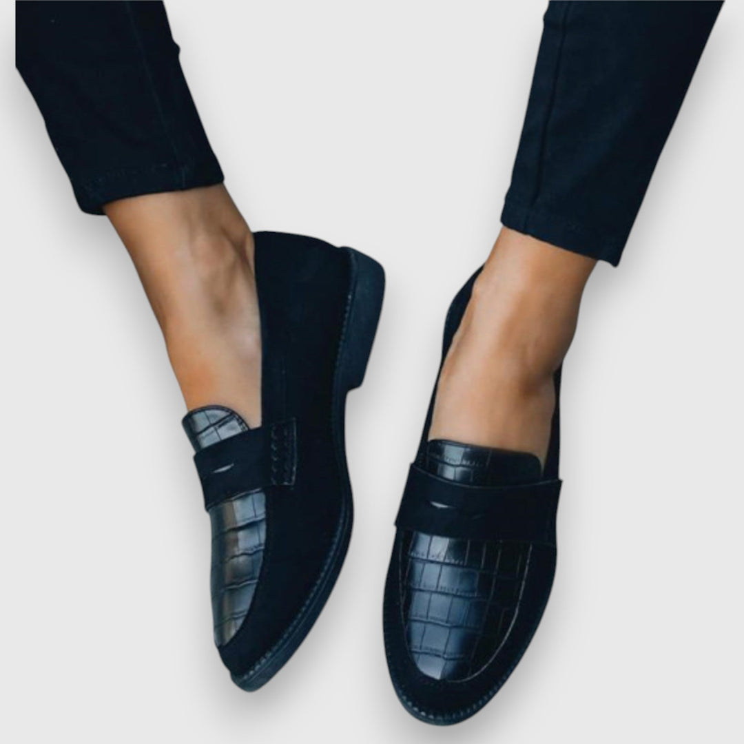 Black men's slip-on loafers for ergonomic all-day comfort, versatile for casual or formal wear.
